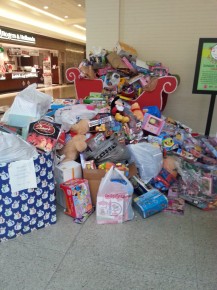 The toys are added to the toy drive pile.