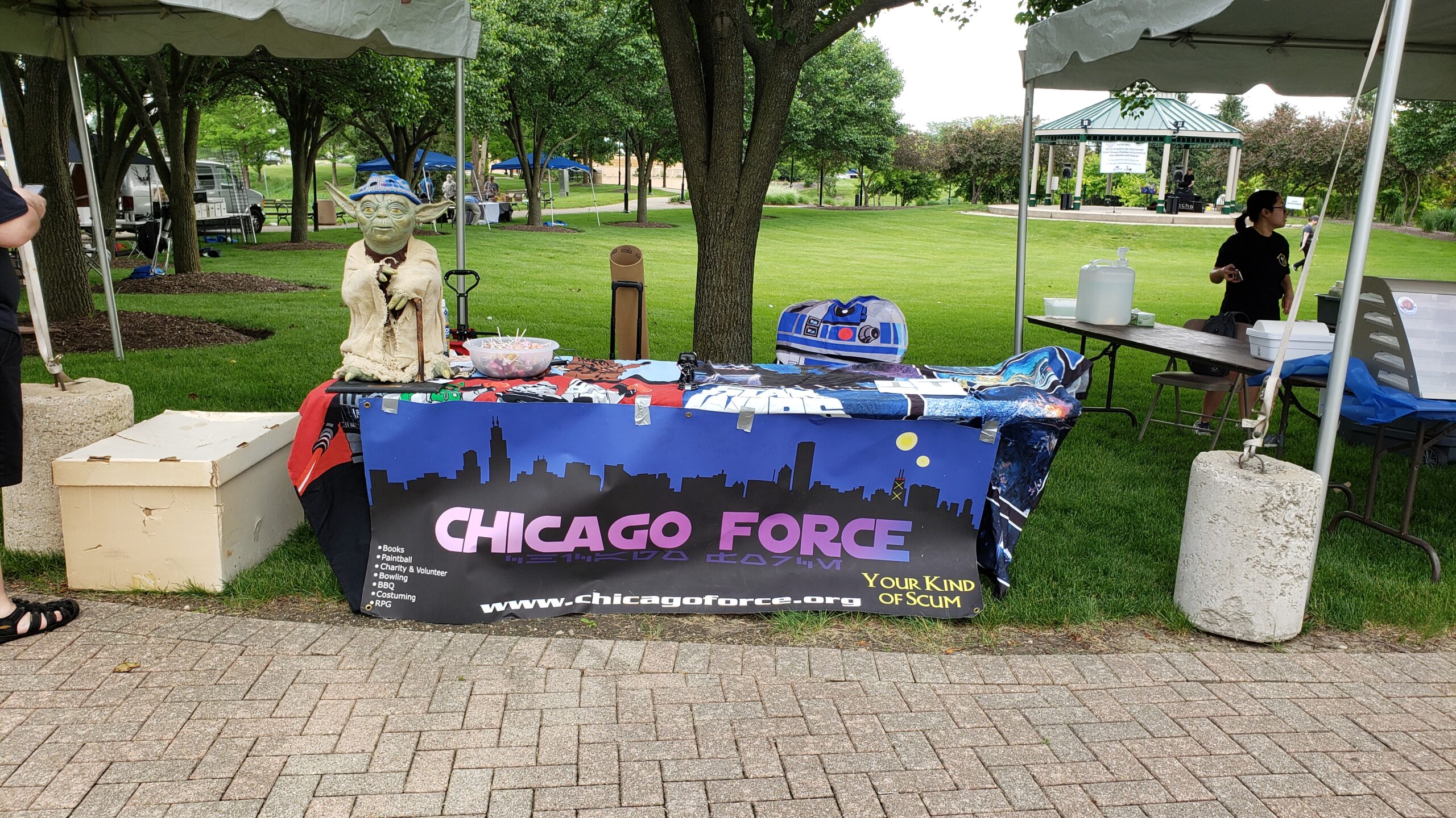 Table outdoor with Chicago Force banner and life-sized yoda