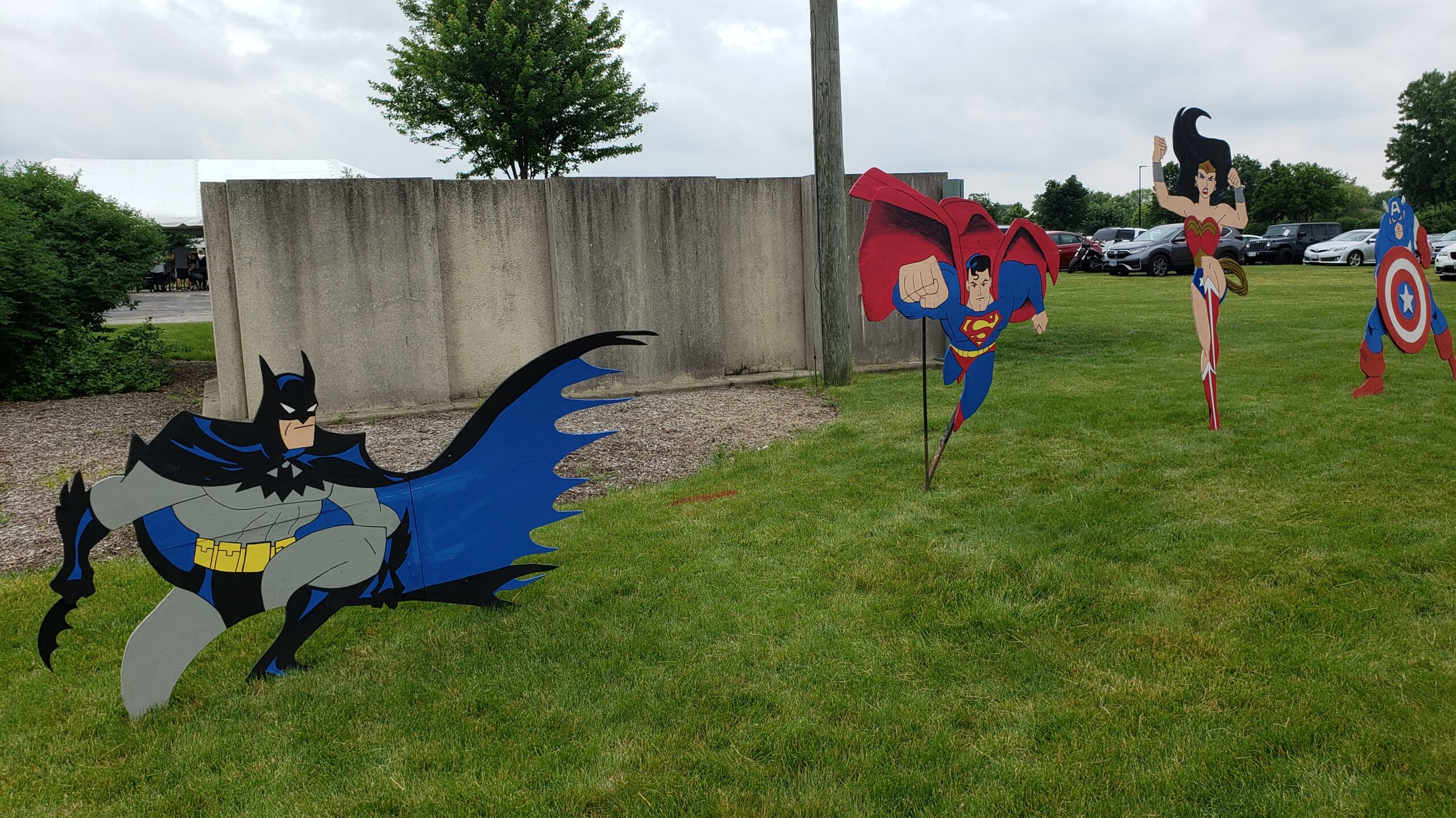 Wooden cutouts of Batman, Superman, Wonder Women and Captain America