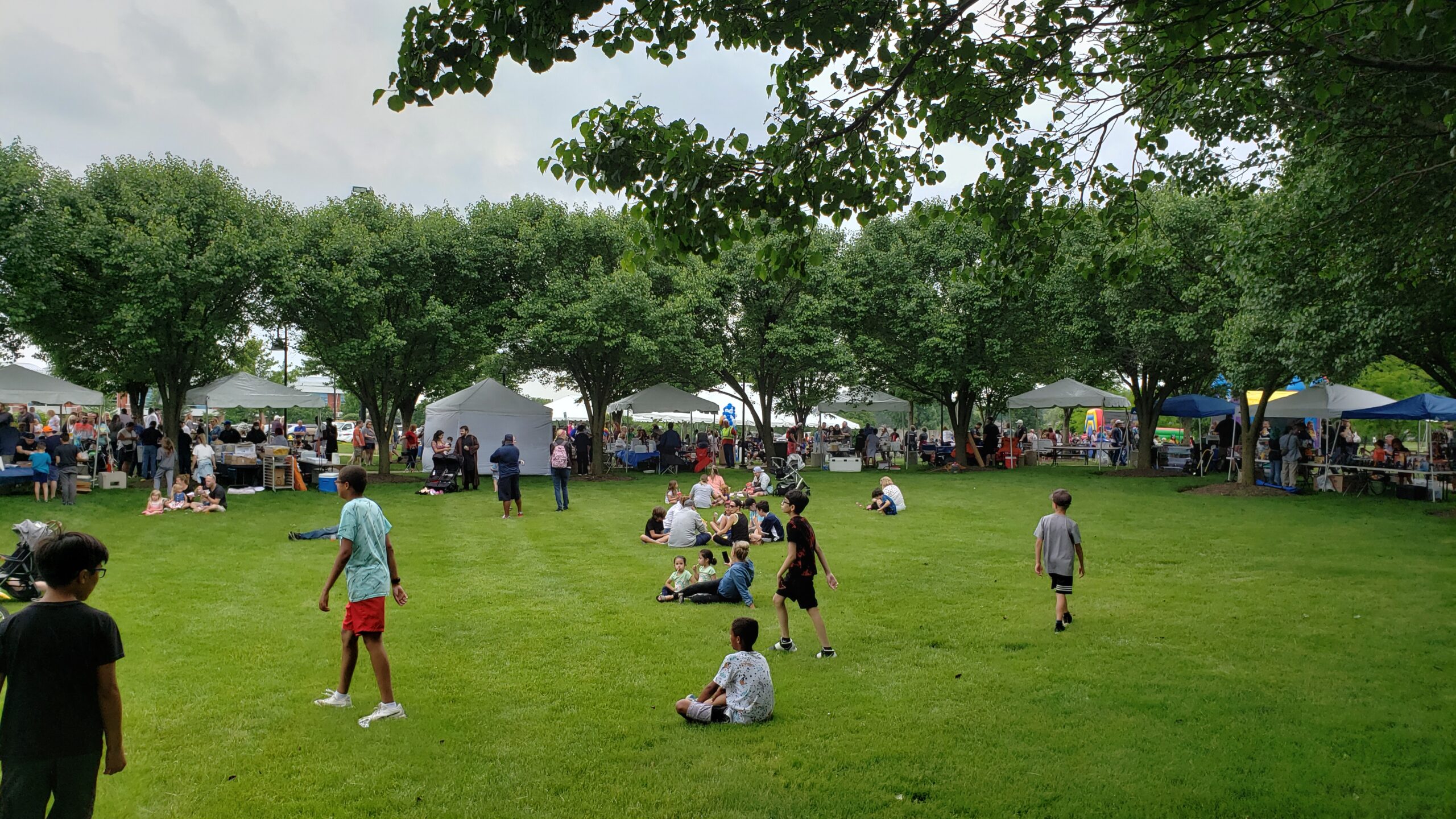 park with tents in background