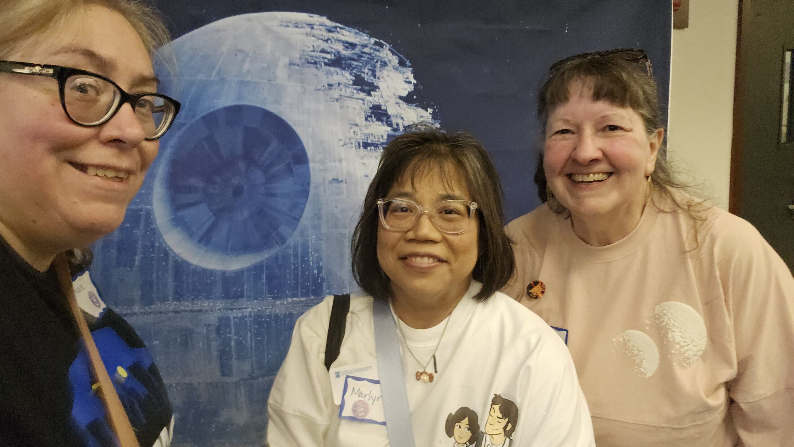 Three women with Death Star in background