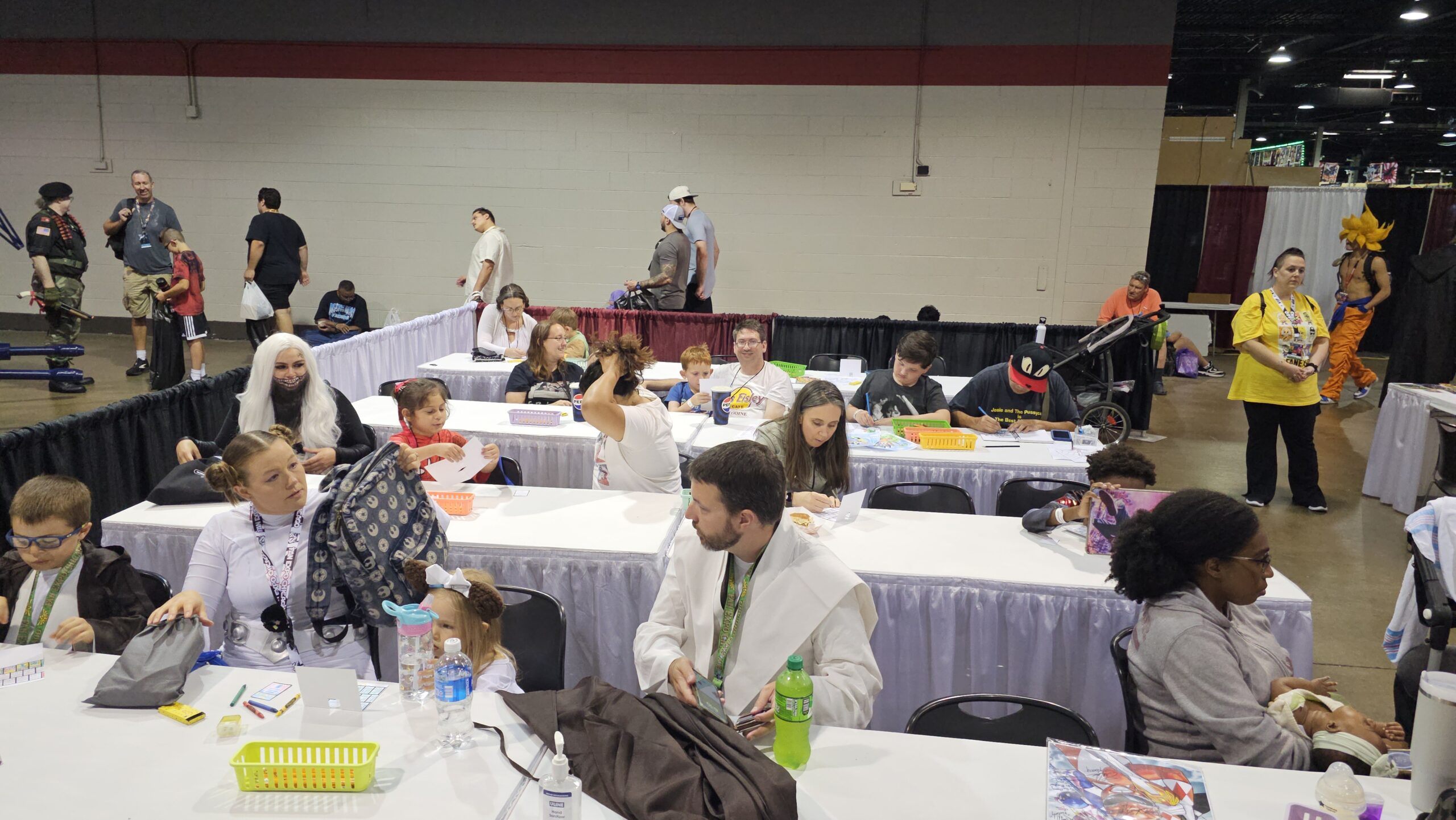 Families sitting at tables for activity