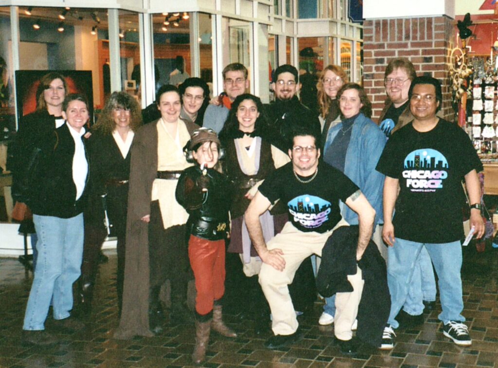 Group of people, some in Star Wars Costumes, some in CF shirts, stand inside Navy Pier