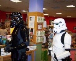 On the left, a stormtrooper with black armor, On the right, a stormtrooper with white armor